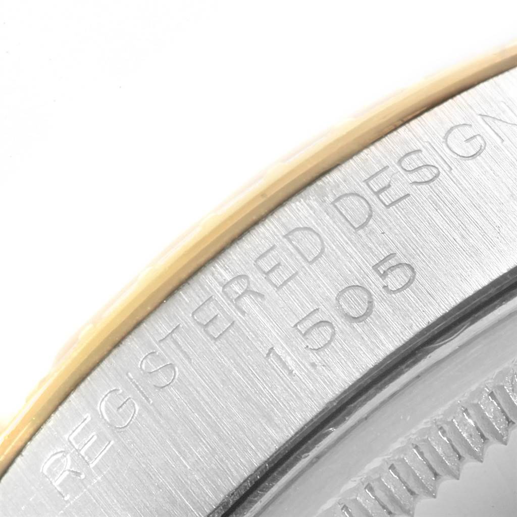 The image shows a close-up of the outer bezel and part of the case back of the Rolex Vintage Collection 1505 Men's Steel and Gold (two tone) White Dial 1505 Men's Steel and Gold (two tone) White Dial model.