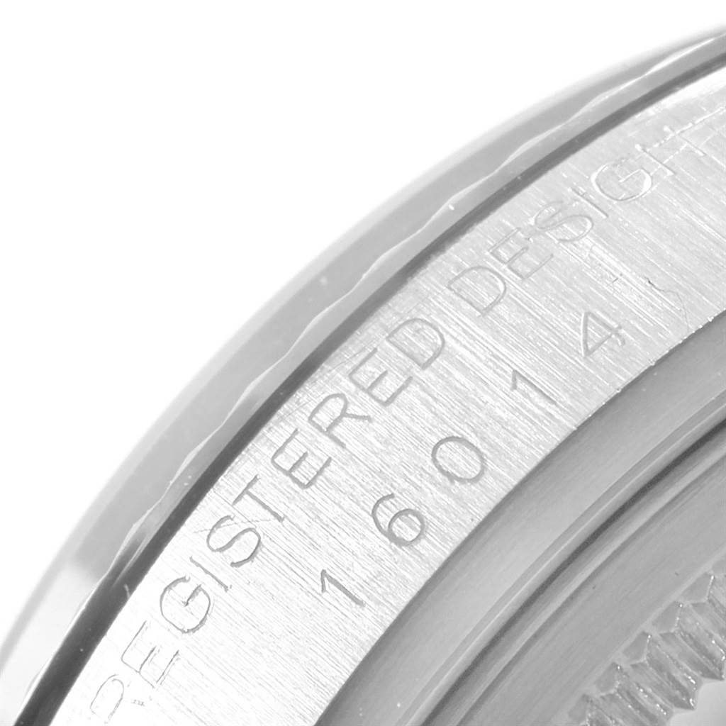 This is a close-up shot of the case side of the Rolex Vintage Collection 16014 Men's Stainless Steel Silver Dial 16014 Men's Stainless Steel Silver Dial model, showing the "REGISTERED DESIGN" engraving and model number.