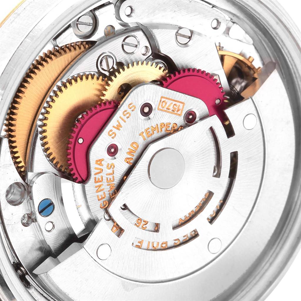 This image shows a detailed close-up of the inner mechanism and gears of a Rolex Vintage Collection 1601 Men's Steel and Gold (two tone) Champagne Dial 1601 Men's Steel and Gold (two tone) Champagne Dial watch.