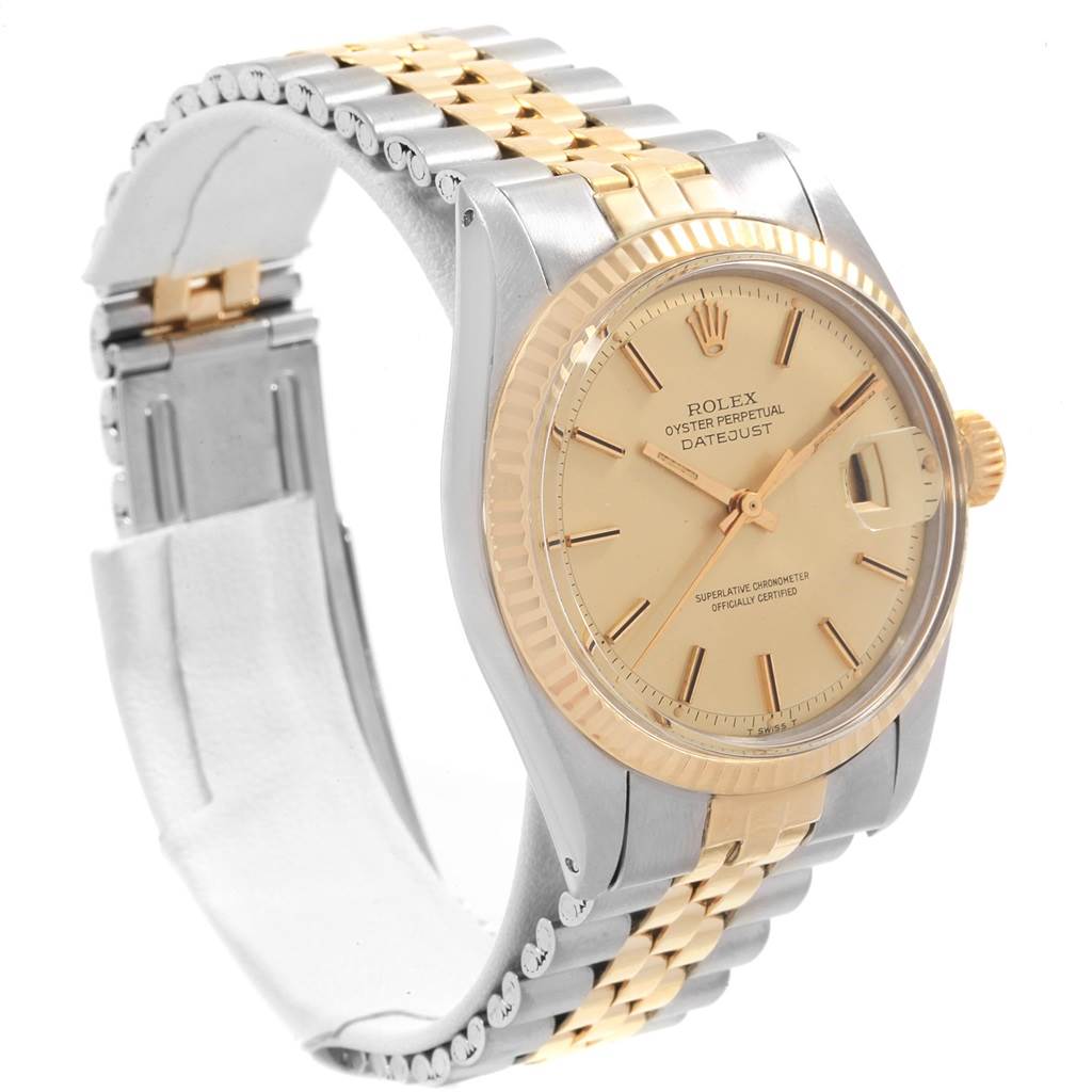 This is a side angle view of a Rolex Vintage Collection 1601 Men's Steel and Gold (two tone) Champagne Dial 1601 Men's Steel and Gold (two tone) Champagne Dial watch displaying the face, crown, and part of the two-toned bracelet.