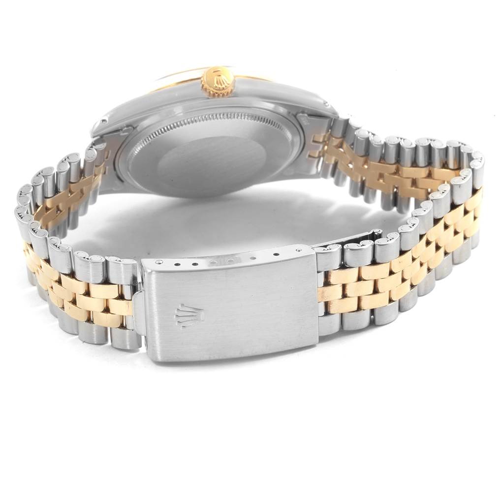 This image shows the case back, crown, and two-tone bracelet with the clasp of the Rolex Vintage Collection 1601 Men's Steel and Gold (two tone) Champagne Dial 1601 Men's Steel and Gold (two tone) Champagne Dial watch from a rear angle.