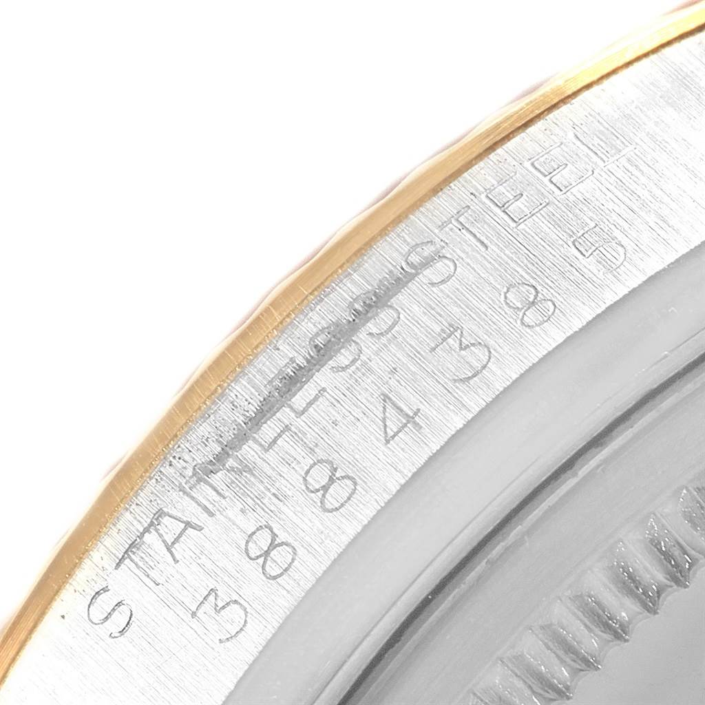 This close-up image of the Vintage Collection Rolex watch shows the engraved serial number on the casing.