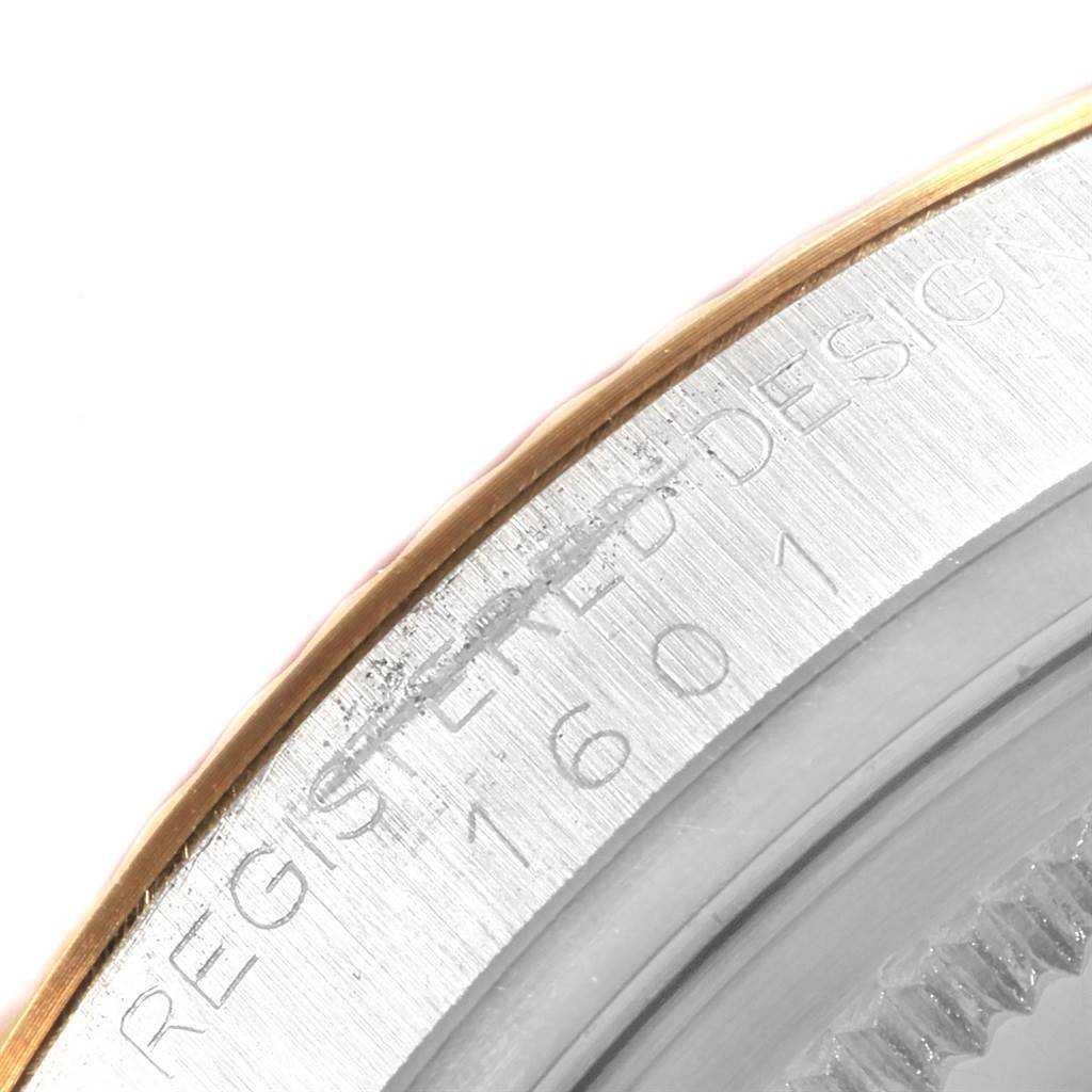 The image shows a close-up of the bezel edge and case side of the Rolex Vintage Collection 1601 Men's Steel and Gold (two tone) Champagne Dial 1601 Men's Steel and Gold (two tone) Champagne Dial model, revealing the engraved model number.