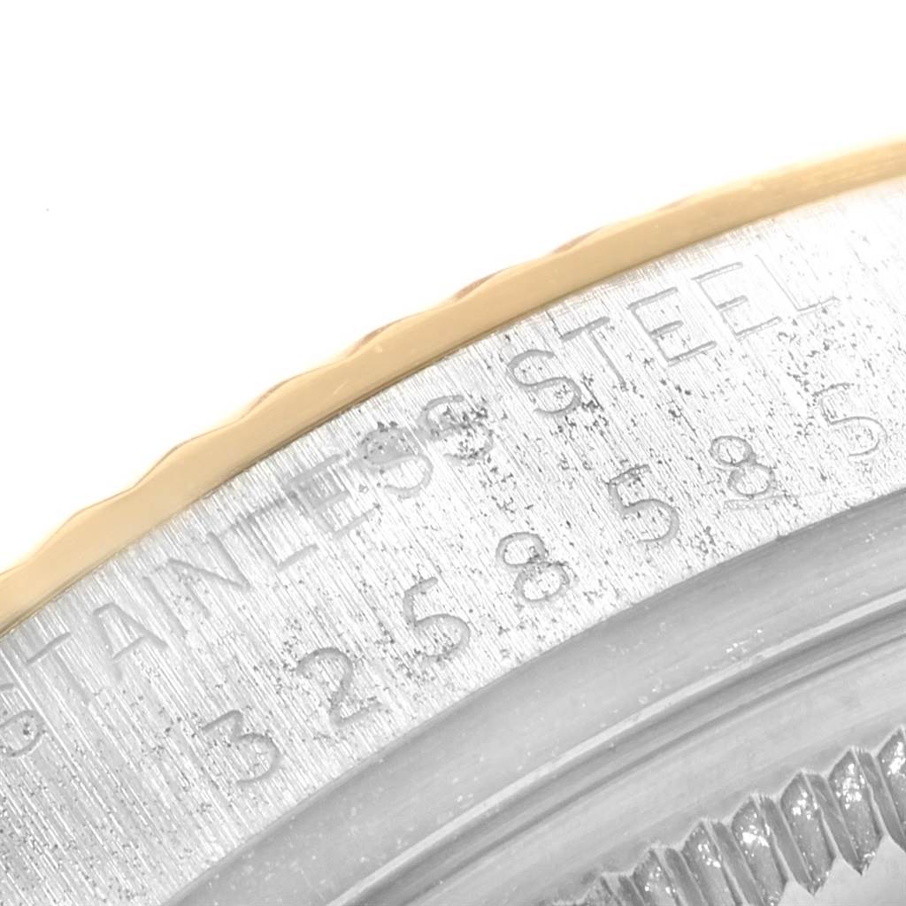 This image shows a close-up view of the outer rim and bezel of a Rolex Vintage Collection 1601 Men's Steel and Gold (two tone) Champagne Dial 1601 Men's Steel and Gold (two tone) Champagne Dial watch.