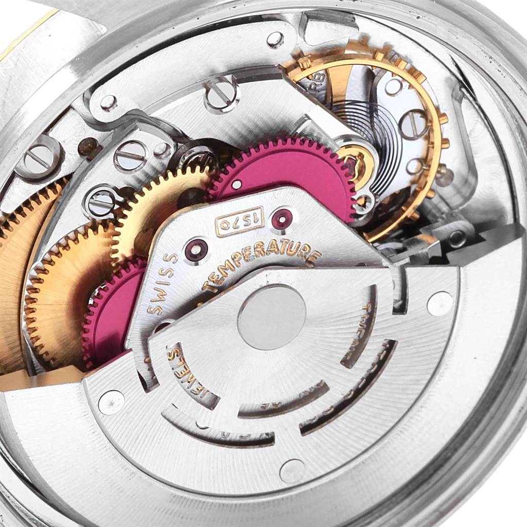 This image shows a close-up view of the movement and inner mechanism of the Rolex Vintage Collection 1601 Men's Steel and Gold (two tone) Champagne Dial 1601 Men's Steel and Gold (two tone) Champagne Dial watch.