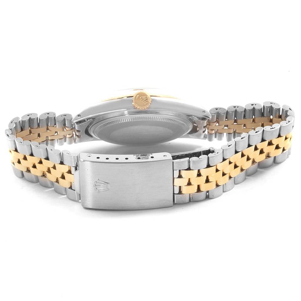 The image shows the backside and bracelet clasp of the Rolex Vintage Collection 1601 Men's Steel and Gold (two tone) Champagne Dial 1601 Men's Steel and Gold (two tone) Champagne Dial watch, highlighting its two-tone metal design.