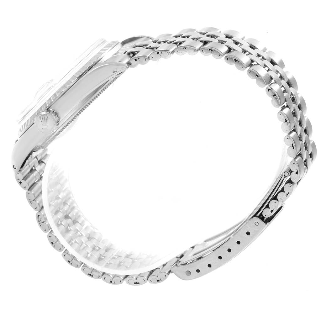 The image shows a side view of the Rolex Vintage Collection 1601 Men's Stainless Steel Silver Dial 1601 Men's Stainless Steel Silver Dial watch, highlighting the watch case and metal bracelet.