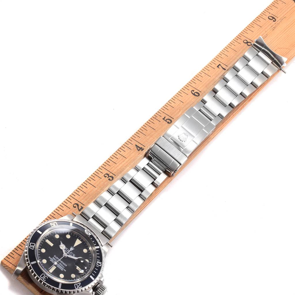 The image shows the full length of a Rolex Vintage Collection 1680 Men's Stainless Steel Black Dial 1680 Men's Stainless Steel Black Dial watch, positioned next to a ruler for scale.