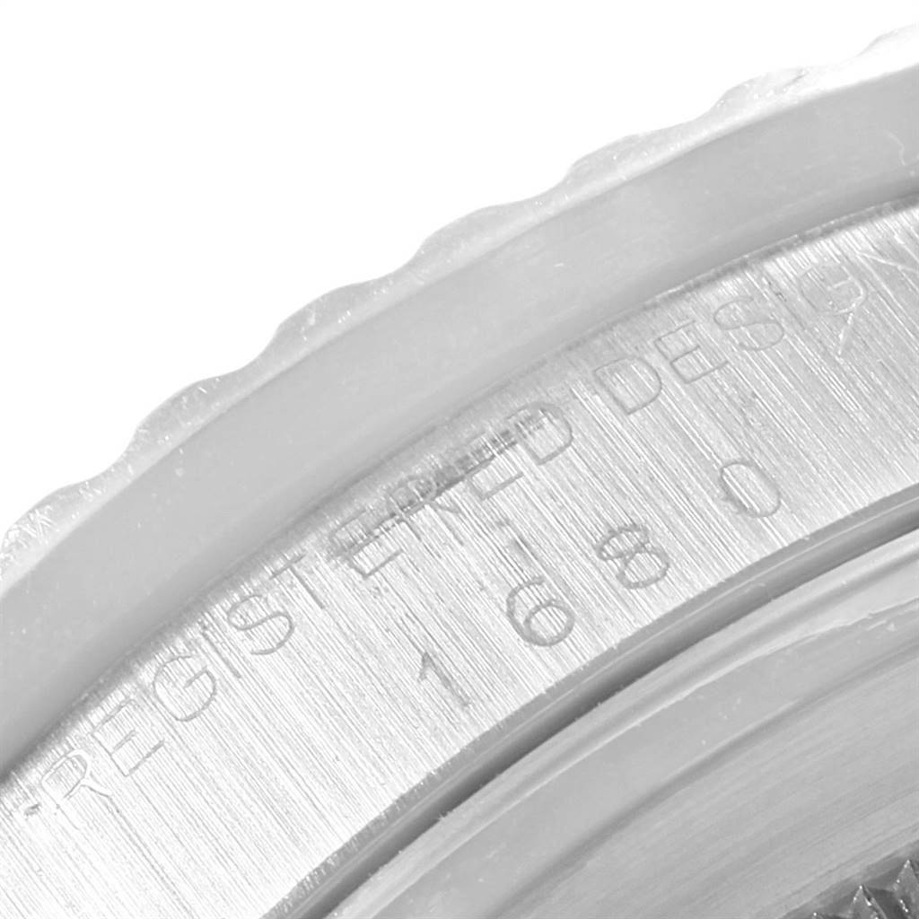 The image shows a close-up of the engraved serial number on the case back edge of a Rolex Vintage Collection 1680 Men's Stainless Steel Black Dial 1680 Men's Stainless Steel Black Dial watch.