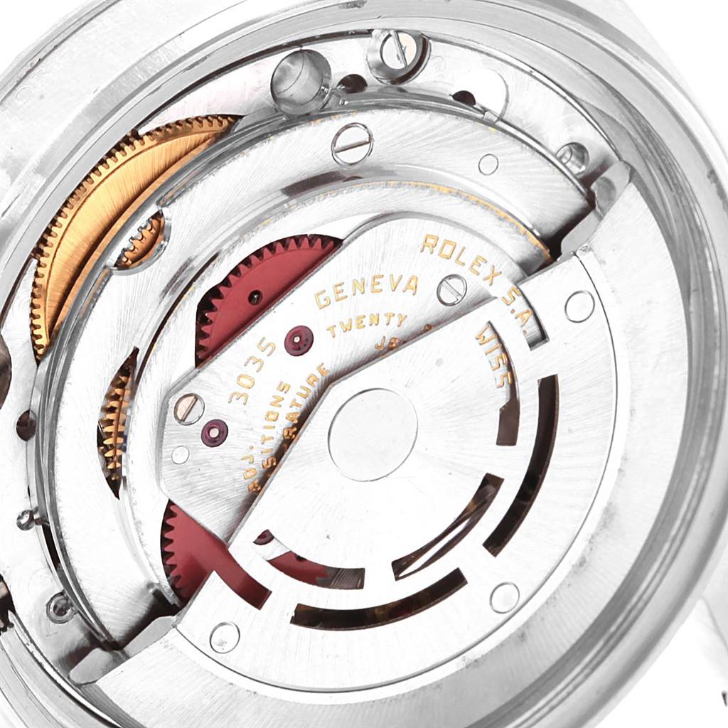 This image shows a close-up of the movement mechanism inside a Vintage Collection Rolex watch.