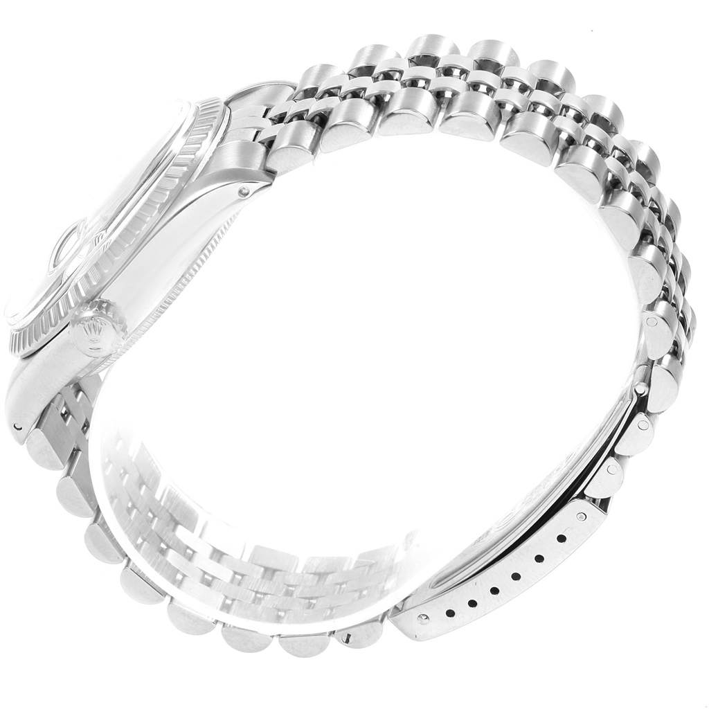 This image shows a side view of a Rolex Vintage Collection 16030 Men's Stainless Steel Silver Dial 16030 Men's Stainless Steel Silver Dial watch, focusing on the watch's case, crown, and bracelet.