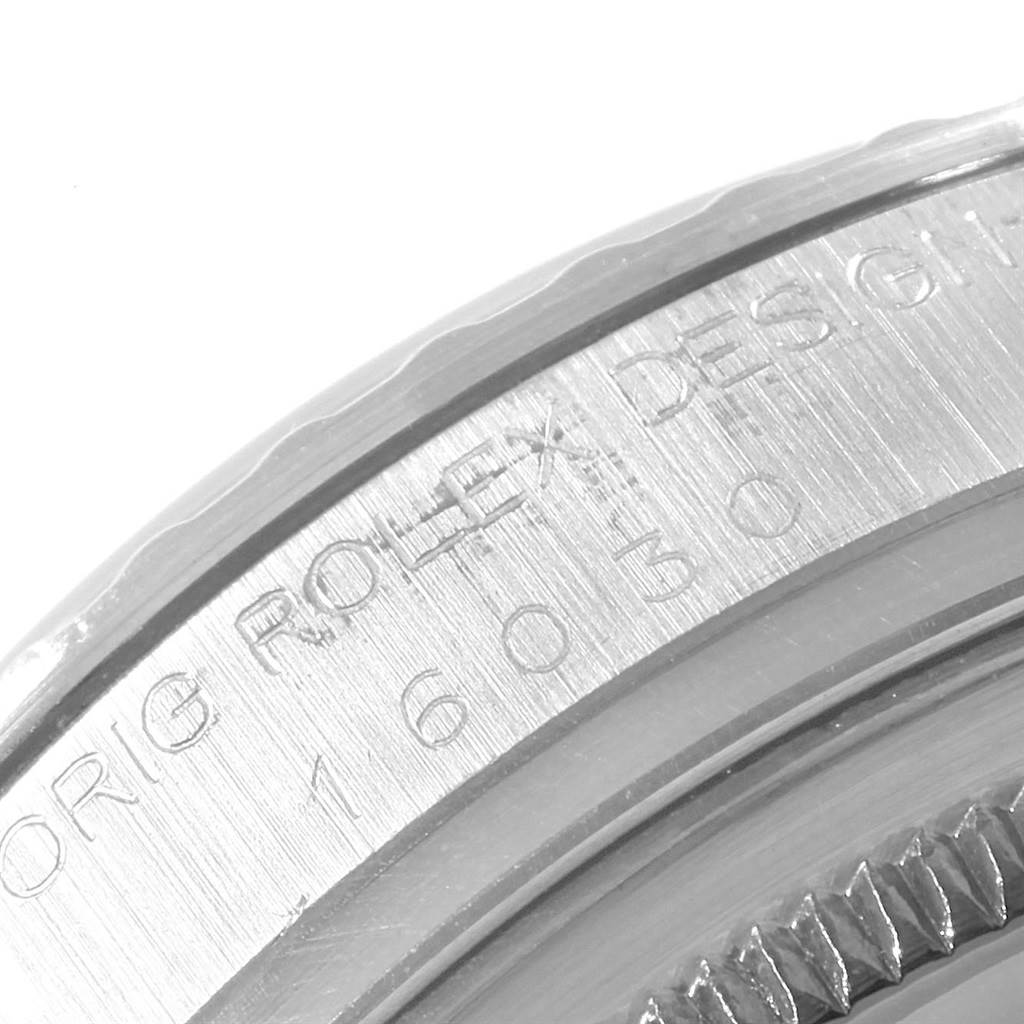 This image shows a close-up of the engraved casing of the Rolex Vintage Collection 16030 Men's Stainless Steel Silver Dial 16030 Men's Stainless Steel Silver Dial watch, focusing on the model number 16030.