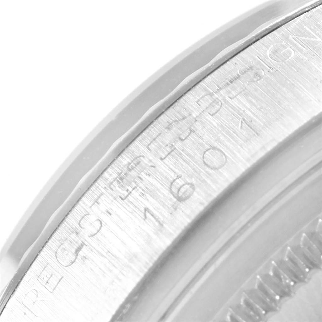 The image shows a close-up angle of the case back and edge of a Rolex Vintage Collection 1601 Men's Stainless Steel Silver Dial 1601 Men's Stainless Steel Silver Dial watch.