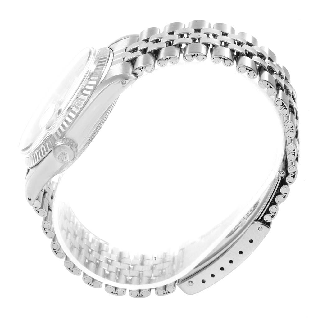 This side view image of the Rolex Vintage Collection 1601 Men's Stainless Steel Silver Dial 1601 Men's Stainless Steel Silver Dial model shows the watch's band and case, detailing the profile and clasp.