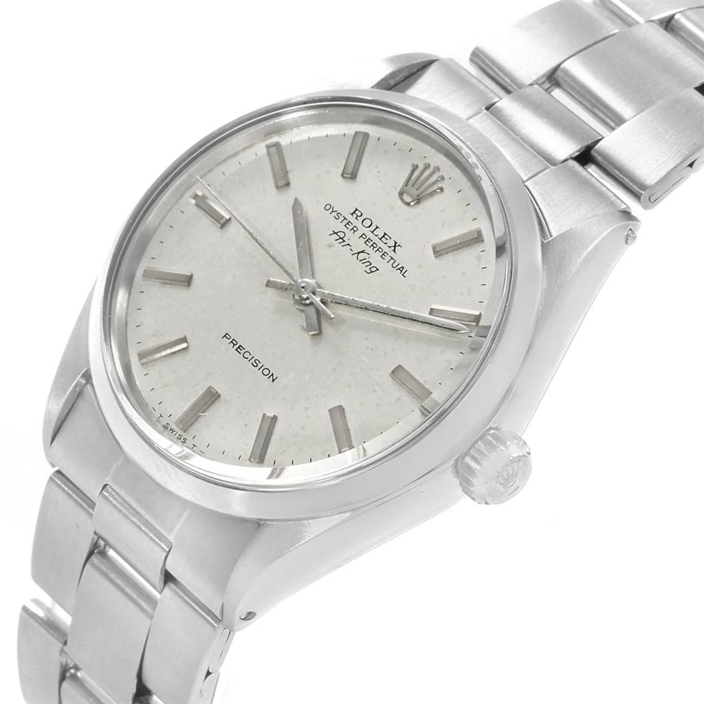 The image shows a close-up of the Rolex Vintage Collection 5500 Men's Stainless Steel Silver Dial 5500 Men's Stainless Steel Silver Dial watch, highlighting the dial, crown, and metal bracelet.