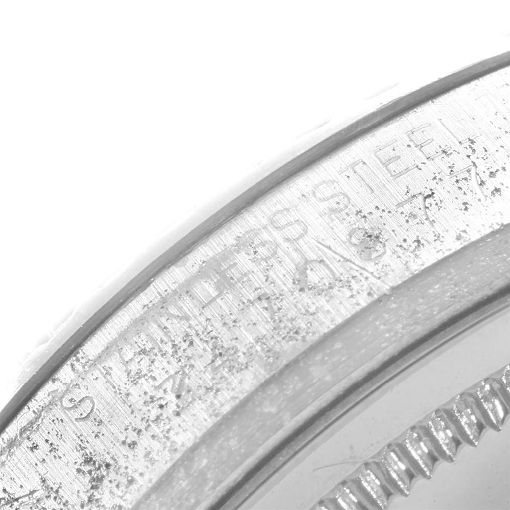 This close-up image shows the stainless steel bezel and outer rim of the dial from a Rolex Vintage Collection 1603 Men's Stainless Steel Grey Dial 1603 Men's Stainless Steel Grey Dial watch.