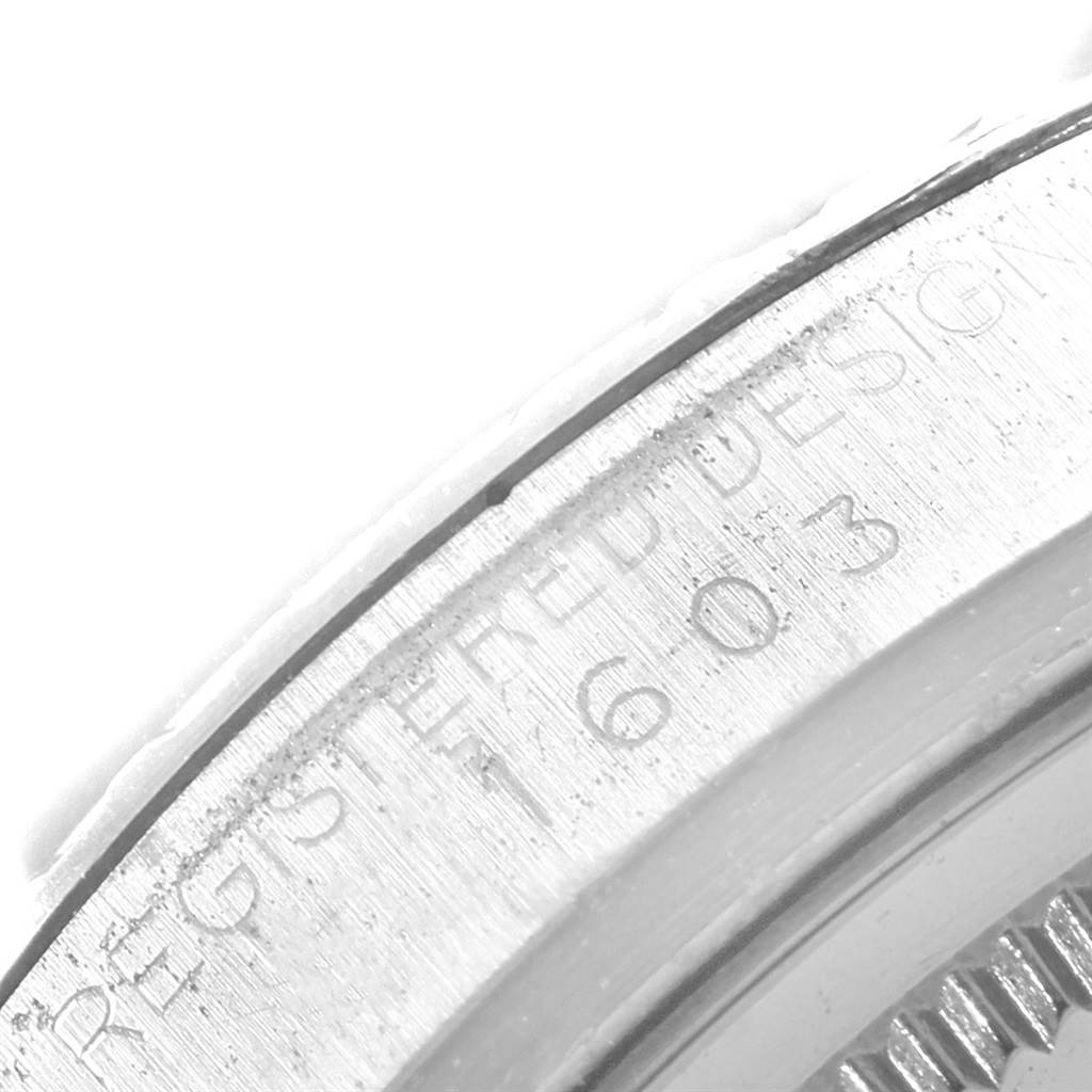 This image shows the side engravings on the bezel of a Rolex Vintage Collection 1603 Men's Stainless Steel Grey Dial 1603 Men's Stainless Steel Grey Dial watch.
