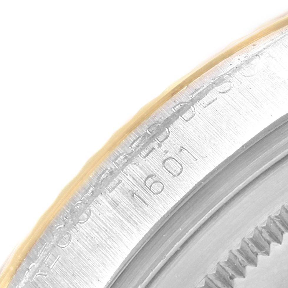 This close-up image shows the engraved case back edge of the Rolex Vintage Collection 1601 Men's Steel and Gold (two tone) Grey Dial 1601 Men's Steel and Gold (two tone) Grey Dial model, highlighting part of its serial number.