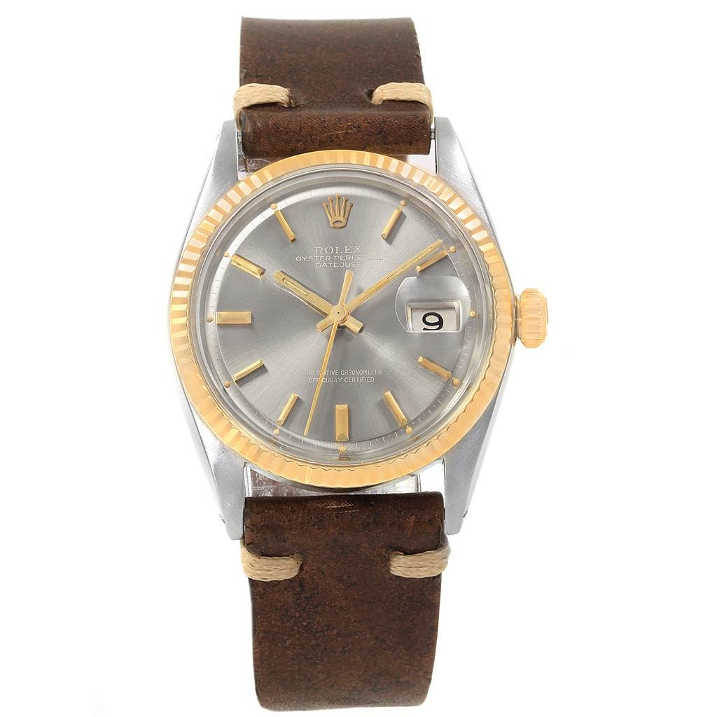 The Rolex Vintage Collection 1601 Men's Steel and Gold (two tone) Grey Dial 1601 Men's Steel and Gold (two tone) Grey Dial watch model is shown from a top-down angle, displaying its face, bezel, crown, and leather strap.