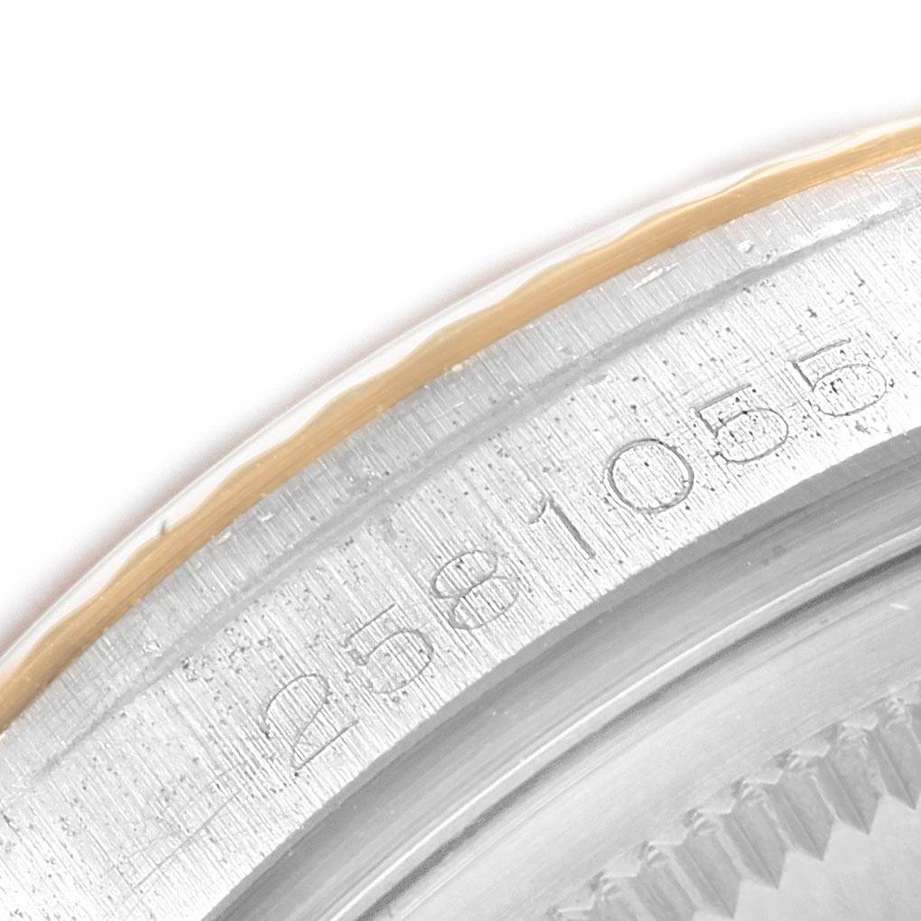 This image shows a close-up of the serial number engraving on the side of the case of a Rolex Vintage Collection 1601 Men's Steel and Gold (two tone) Grey Dial 1601 Men's Steel and Gold (two tone) Grey Dial model.