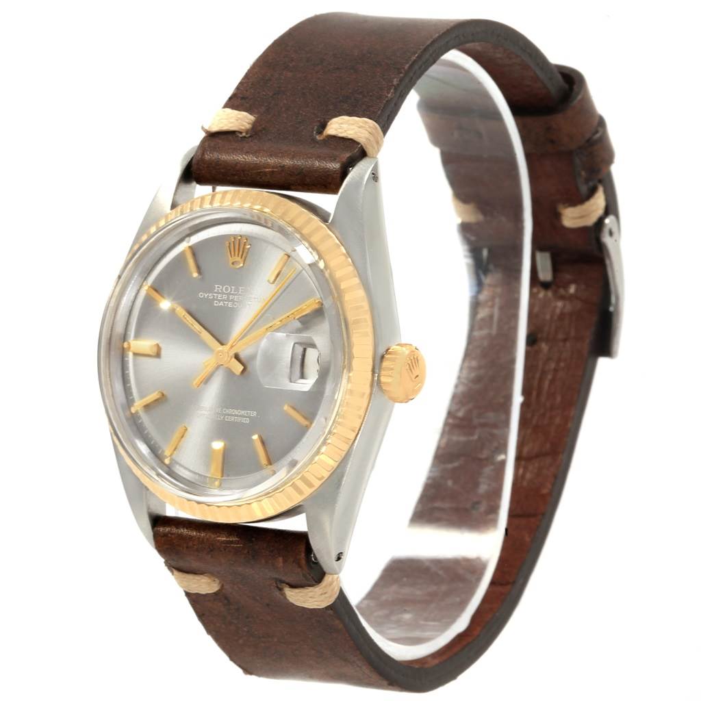 This image shows a Rolex Vintage Collection 1601 Men's Steel and Gold (two tone) Grey Dial 1601 Men's Steel and Gold (two tone) Grey Dial watch at a three-quarter angle, highlighting the face, bezel, crown, and leather strap.