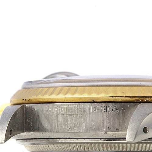 This image shows a side angle of the Rolex Vintage Collection 16013 Men's Stainless Steel Blue Dial 16013 Men's Stainless Steel Blue Dial watch, focusing on the case with visible serial numbers and part of the bezel.