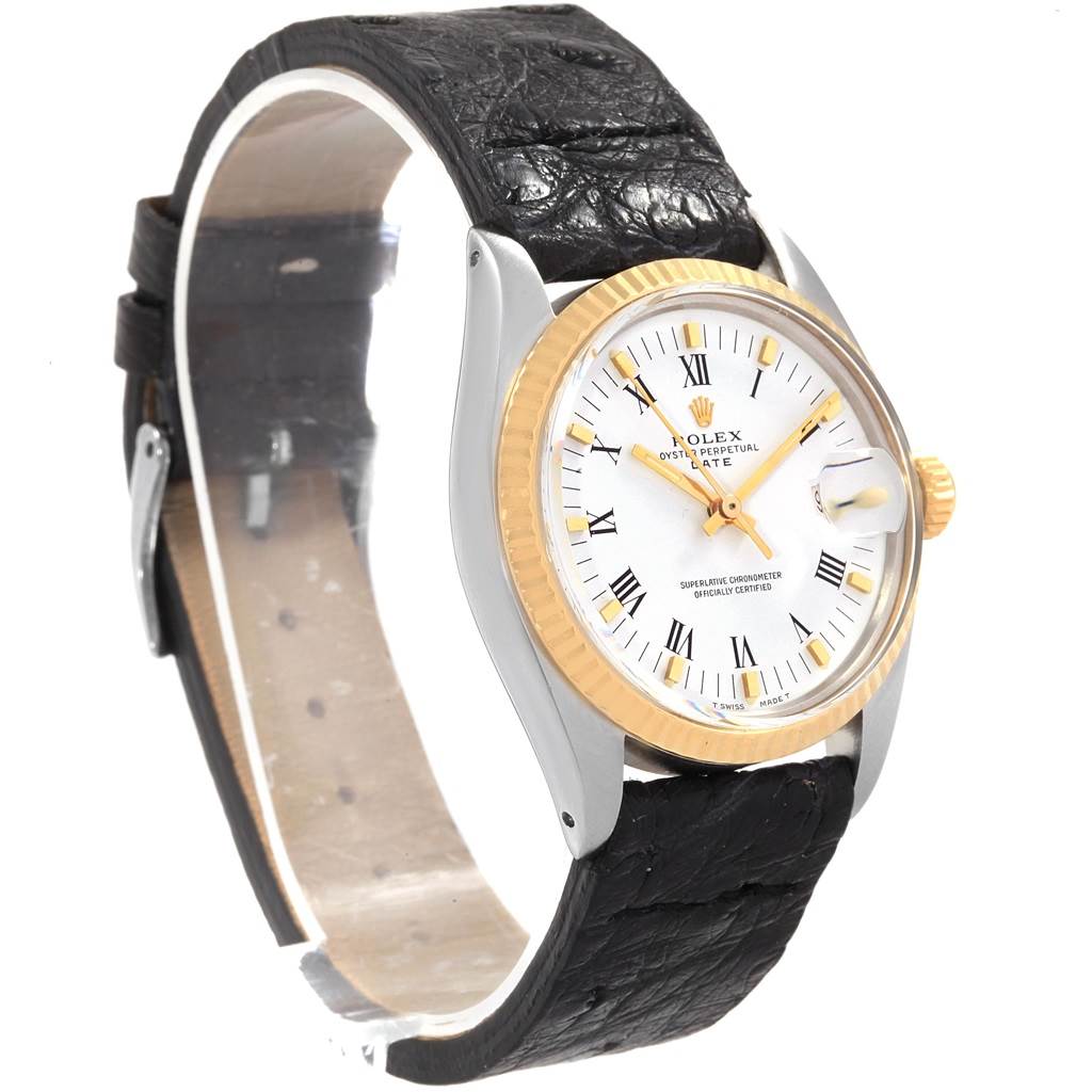 The image shows a Vintage Collection Rolex watch from an angled side view, highlighting the dial, bezel, crown, and leather strap.