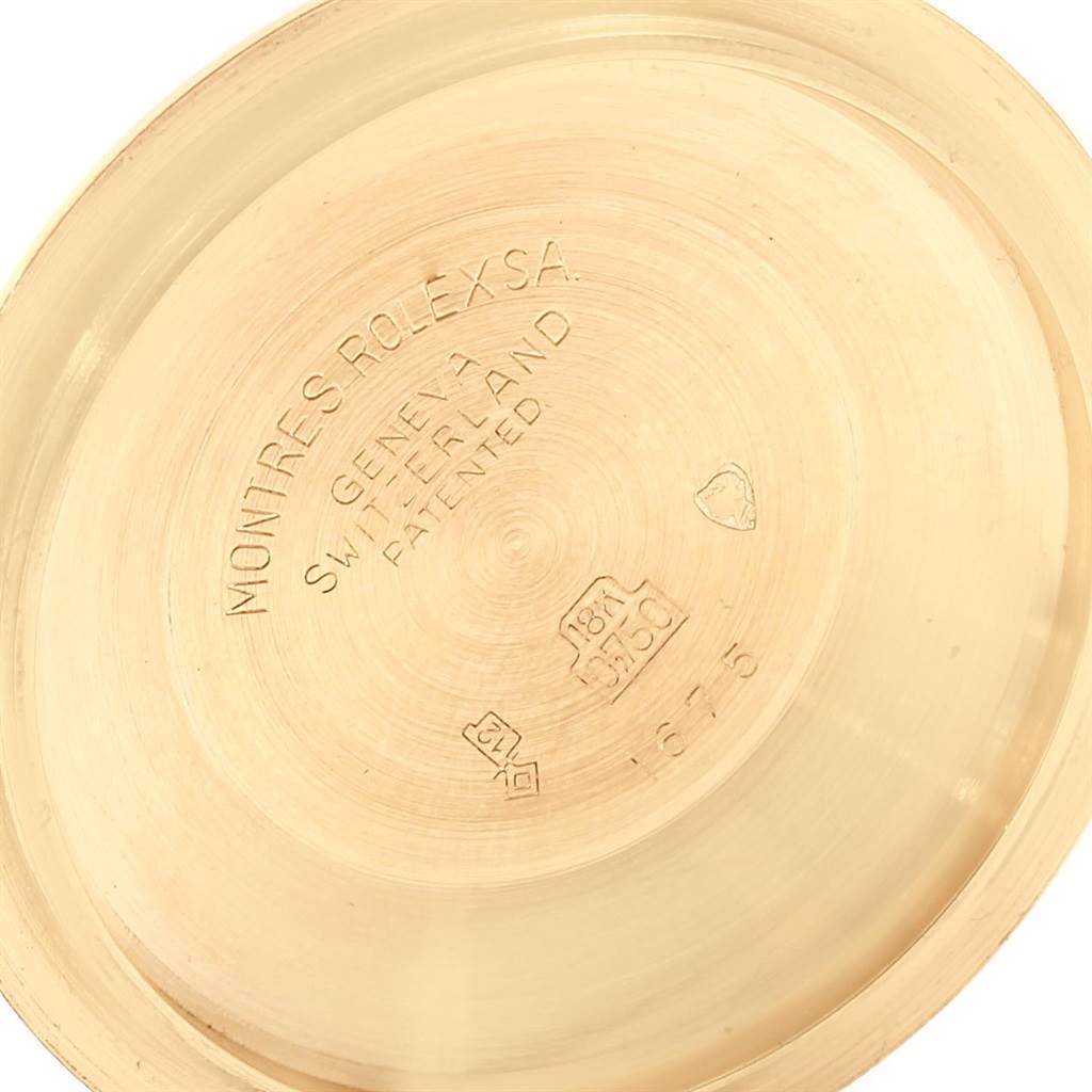 This image shows the interior back cover of a Vintage Collection Rolex watch, displaying the brand's markings and engravings.