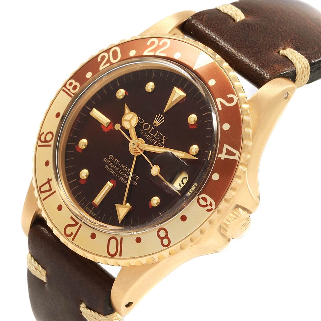 This image shows a close-up angled view of a Rolex Vintage Collection 1675 Men's Yellow Gold Brown Dial 1675 Men's Yellow Gold Brown Dial GMT-Master, displaying the dial, bezel, case, and strap.