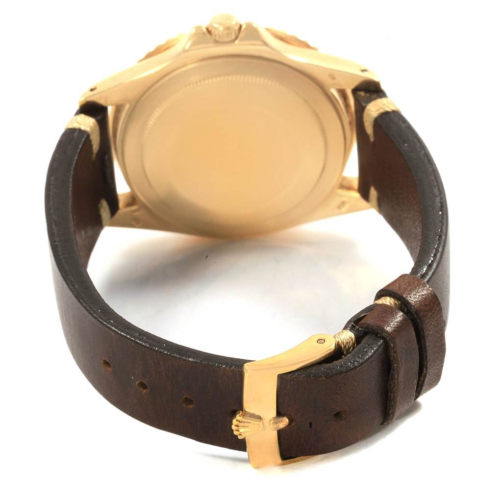 The image shows the back and clasp of the Vintage Collection Rolex watch with a brown leather strap.