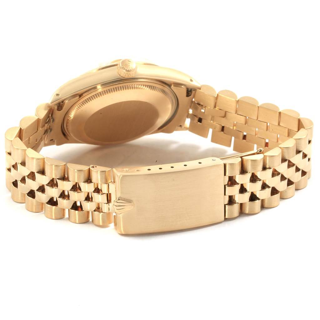 The image shows the backside and clasp of a Rolex Vintage Collection 15037 Men's Yellow Gold Champagne Dial 15037 Men's Yellow Gold Champagne Dial watch with a gold bracelet.