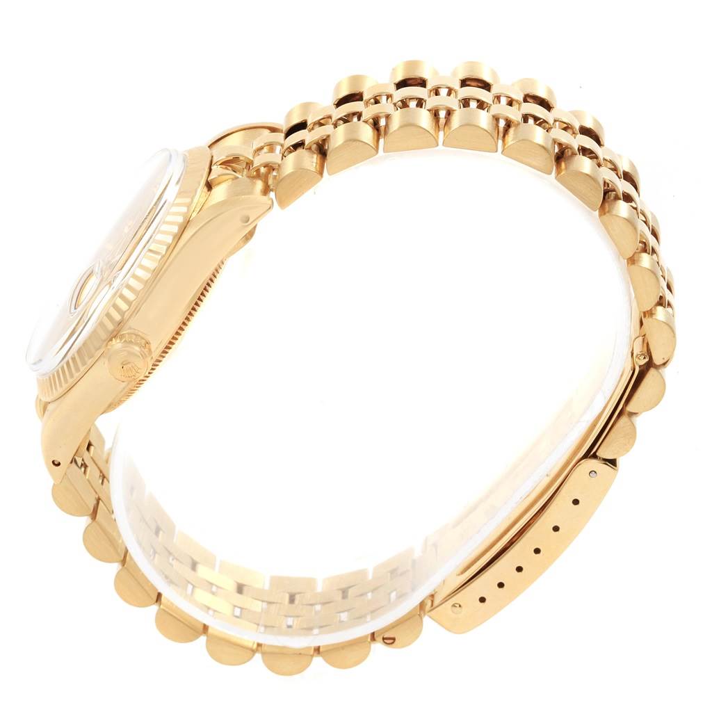 The image shows a side view of a Vintage Collection Rolex watch, highlighting the gold bracelet and crown.