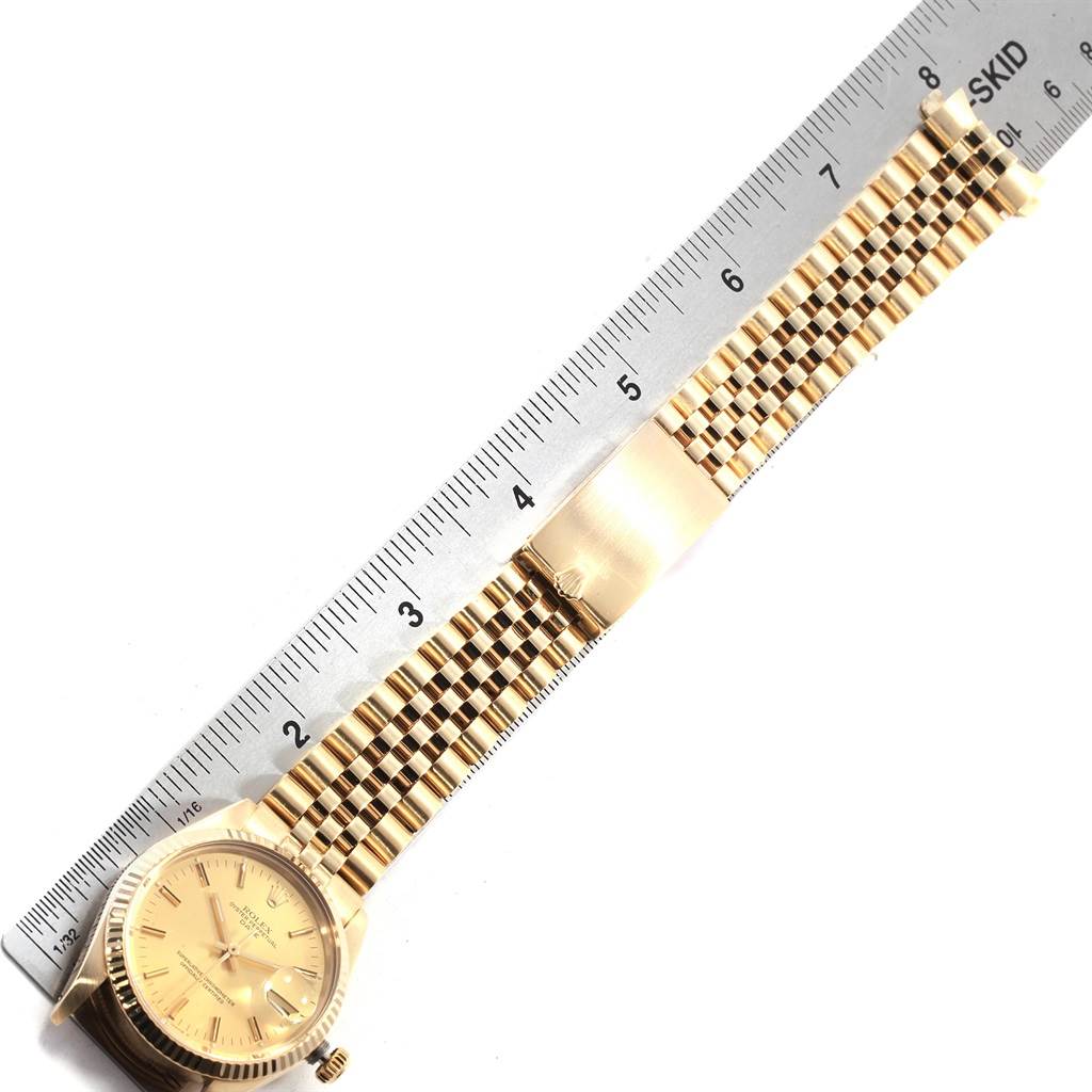 The image shows a Vintage Collection model by Rolex watch from a top-down angle, highlighting the face, strap, and a ruler for scale.