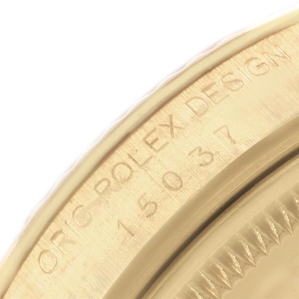 The image shows a close-up view of the engraved bezel on a Vintage Collection model by Rolex.