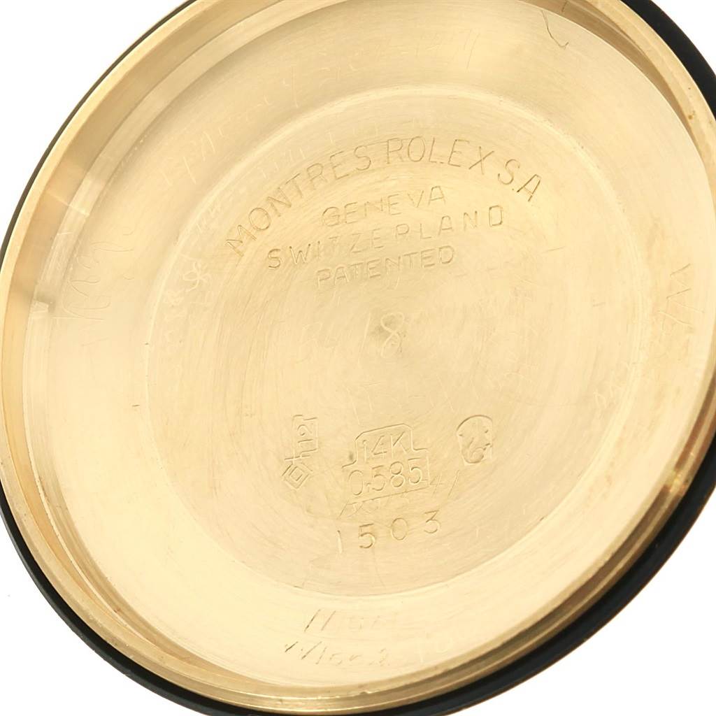 The image shows the inner case back of a Vintage Collection model by Rolex at a slight angle.