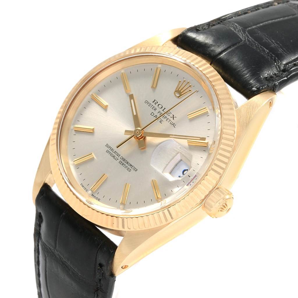 The Rolex Vintage Collection 1503 Men's Yellow Gold Silver Dial 1503 Men's Yellow Gold Silver Dial watch is shown from an angled top view, highlighting its face, bezel, and black leather strap.