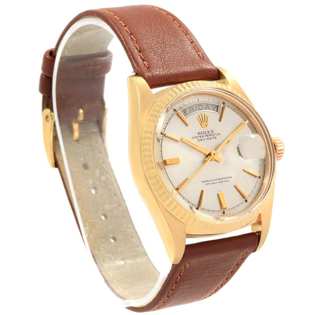The Rolex Vintage Collection 1803 Men's Yellow Gold Silver Dial 1803 Men's Yellow Gold Silver Dial watch is shown at an angled side view, highlighting its dial, bezel, case, and brown leather strap.