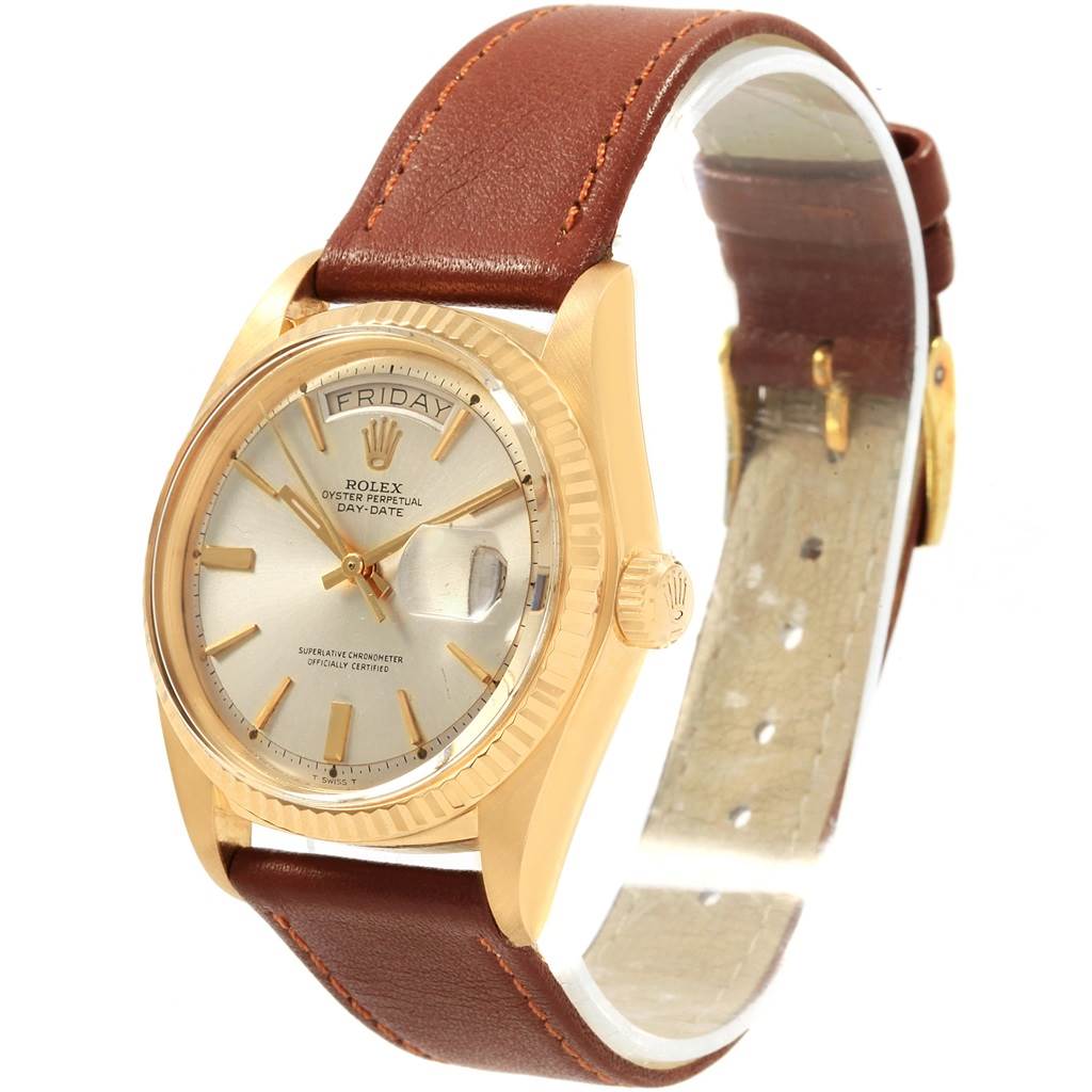 This Vintage Collection Rolex Oyster Perpetual Day-Date watch is shown at a slight angle highlighting the dial, crown, and brown leather strap.