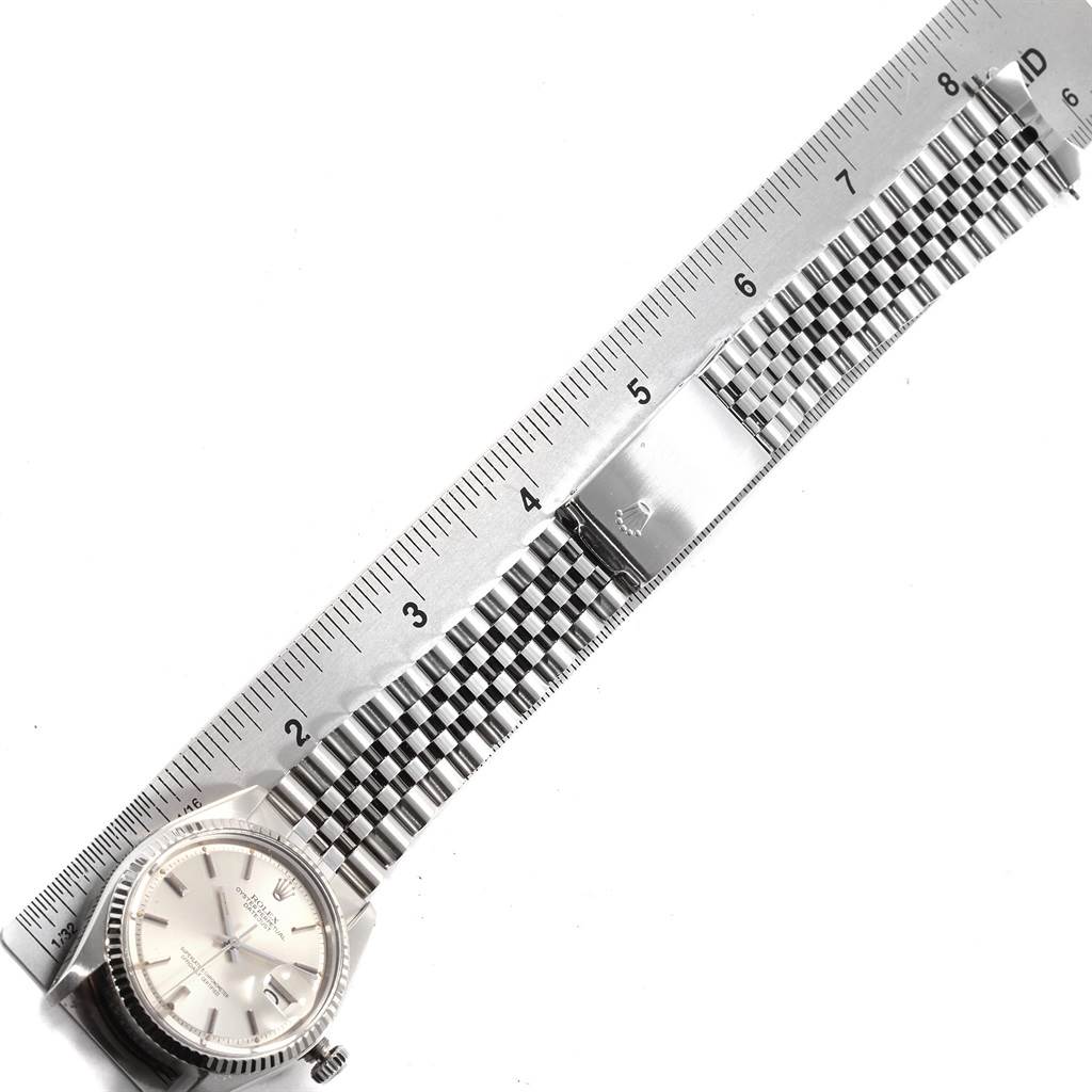 The image shows the face and metal bracelet of the Rolex Vintage Collection 1601 Men's Stainless Steel Silver Dial 1601 Men's Stainless Steel Silver Dial watch, lying flat next to a ruler for measurement.