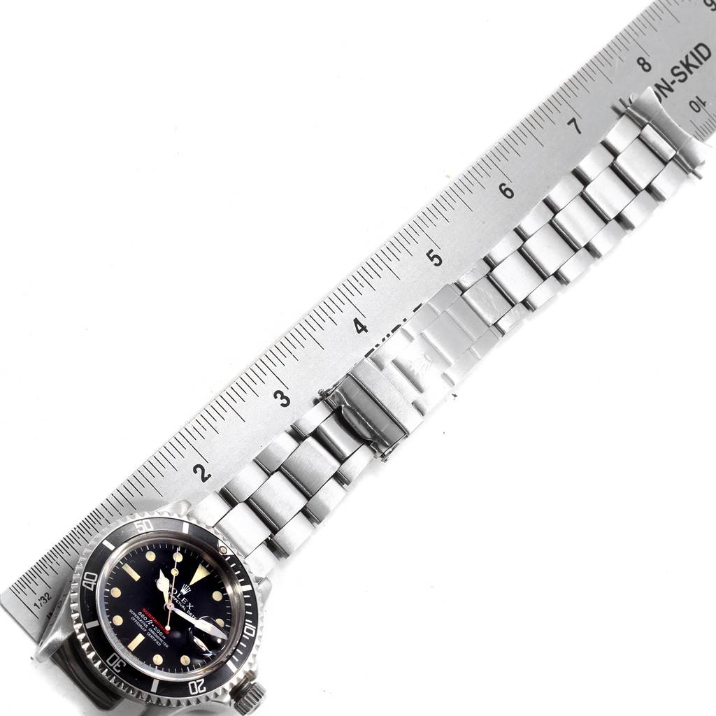 This image shows a Rolex Vintage Collection 1680 Men's Stainless Steel Black Dial 1680 Men's Stainless Steel Black Dial watch laid flat with both the dial and bracelet visible, measured against a ruler.