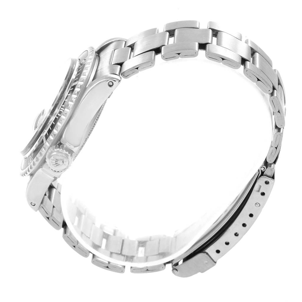 The Rolex Vintage Collection 1680 Men's Stainless Steel Black Dial 1680 Men's Stainless Steel Black Dial watch is shown from a side angle, highlighting the bracelet, clasp, case, and crown.