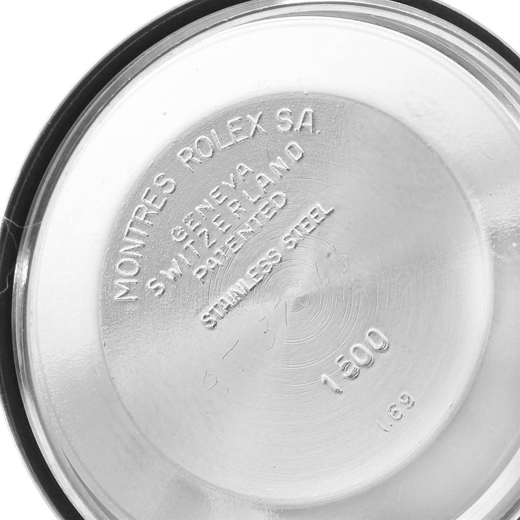 This image shows the inside case back of a Vintage Collection Rolex watch, displaying text and numbers.