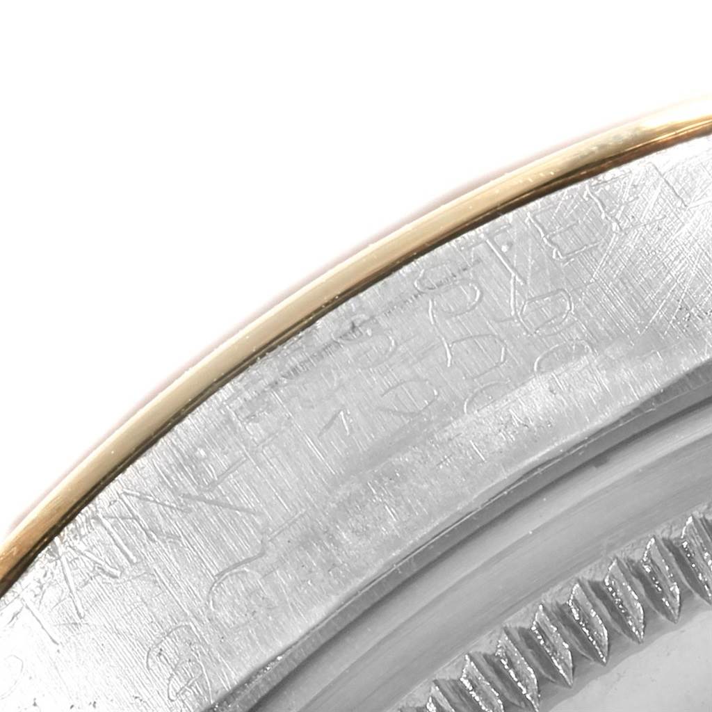 This close-up image shows the engraved outer edge and bezel of a Rolex Vintage Collection 1500 Men's Steel and Gold (two tone) Silver Dial 1500 Men's Steel and Gold (two tone) Silver Dial model watch.