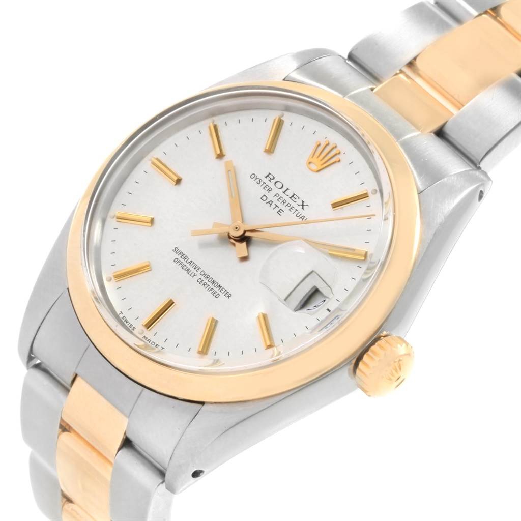 This image shows a close-up angle of the Rolex Vintage Collection 1500 Men's Steel and Gold (two tone) Silver Dial 1500 Men's Steel and Gold (two tone) Silver Dial watch face, including the dial, date window, crown, and bracelet.