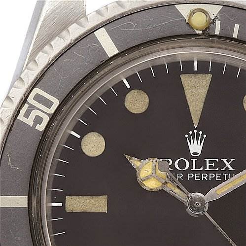 The image shows a close-up of the dial and bezel of the Vintage Collection model by Rolex.
