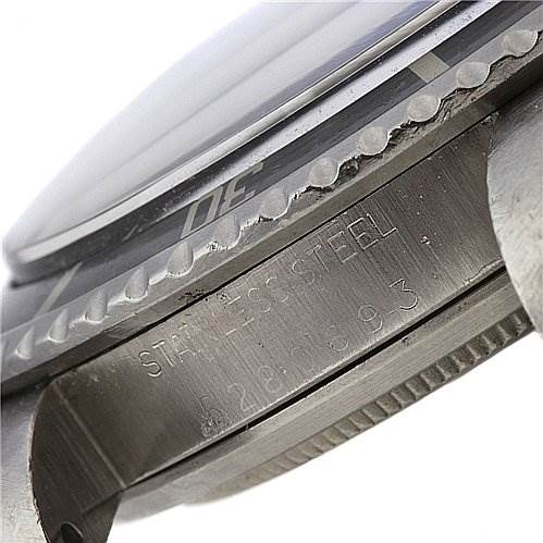 A close-up view of the side of the Rolex Vintage Collection 5513 Men
s Stainless Steel Black Dial 5513 Men
s Stainless Steel Black Dial watch, showing the bezel, case, and engraved serial number.
