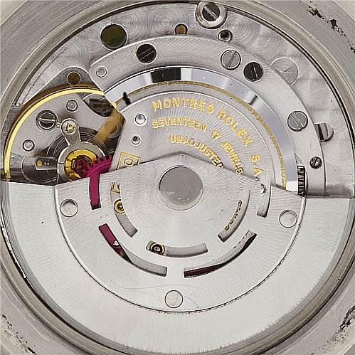 The image shows the internal mechanism of the Rolex Vintage Collection 5513 Men
s Stainless Steel Black Dial 5513 Men
s Stainless Steel Black Dial watch, focusing on the movement and gears.