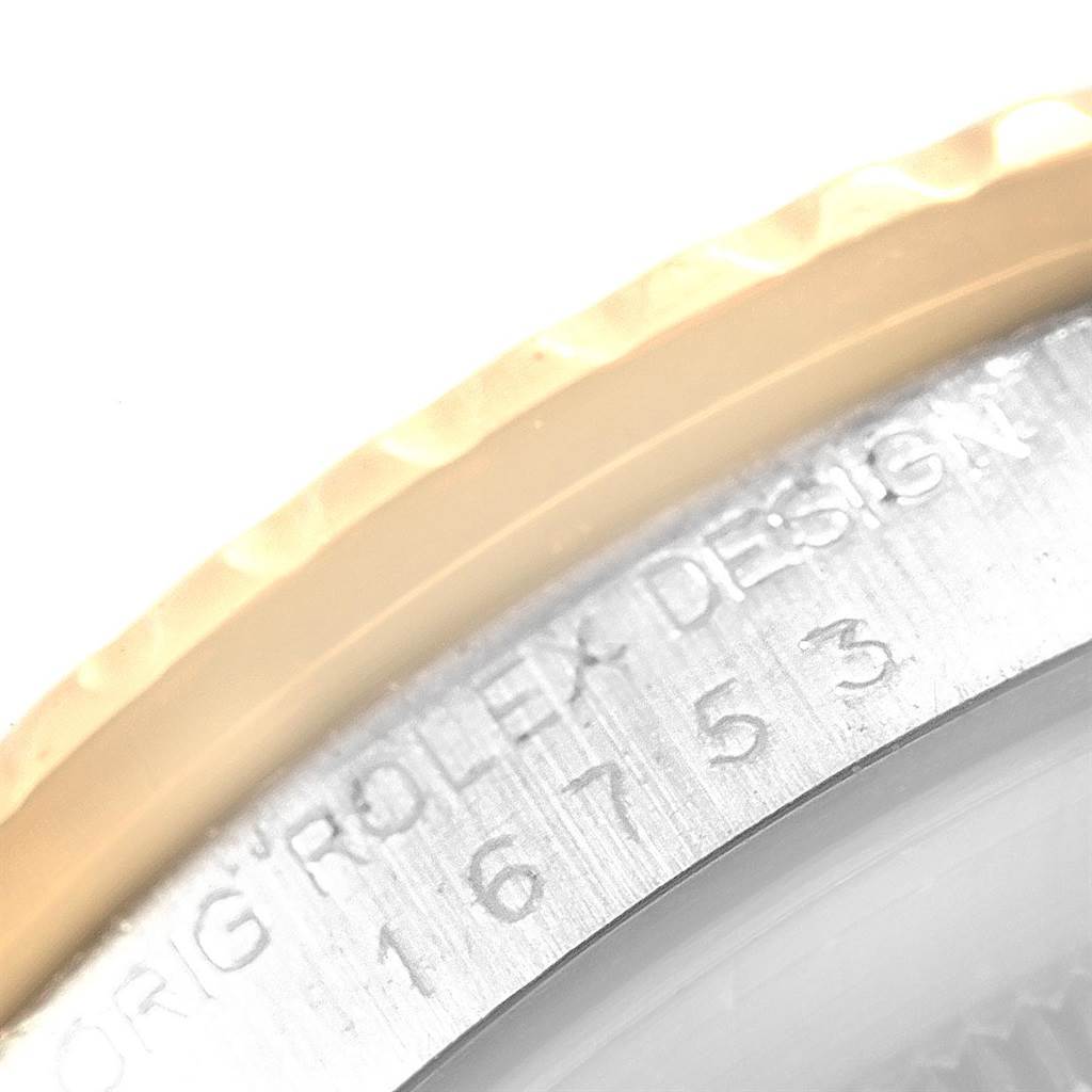 This image shows a close-up of the engraved case back of a Vintage Collection model by Rolex.
