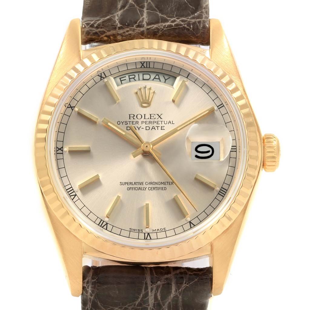 The image shows a frontal view of the Rolex Vintage Collection 18038 Men's Yellow Gold Silver Dial 18038 Men's Yellow Gold Silver Dial model, highlighting the face, hands, crown, and parts of the strap.