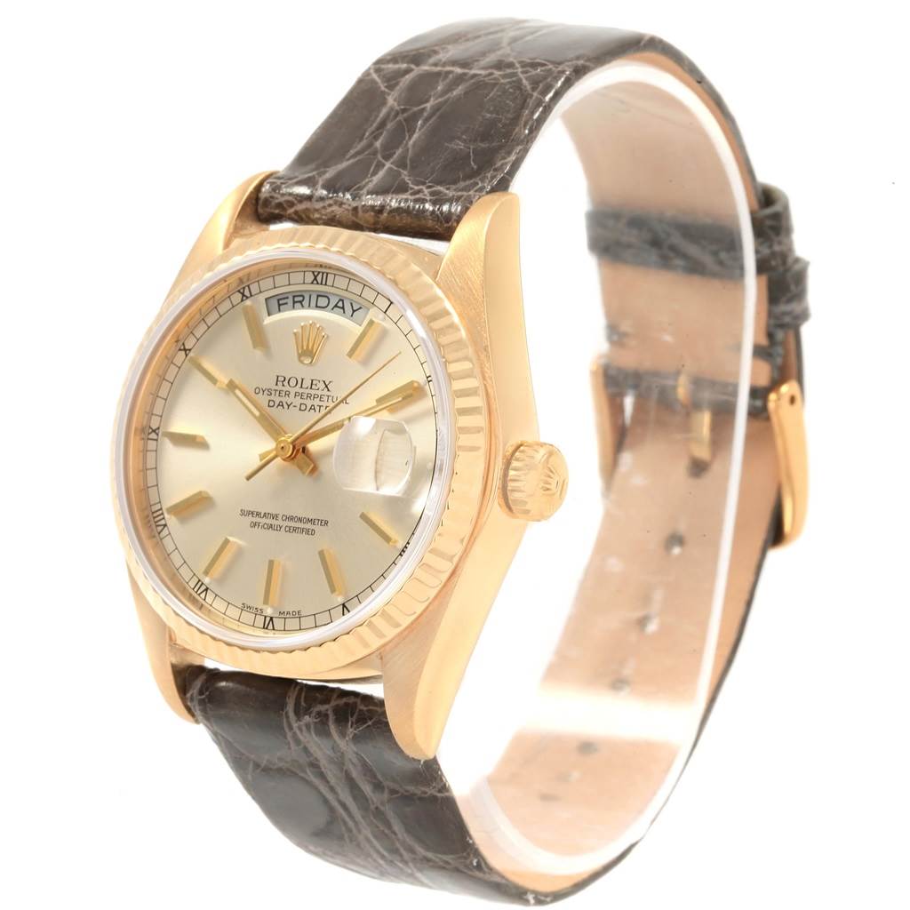 The Rolex Vintage Collection 18038 Men's Yellow Gold Silver Dial 18038 Men's Yellow Gold Silver Dial model watch shown is angled to display the face, crown, bezel, and leather strap.